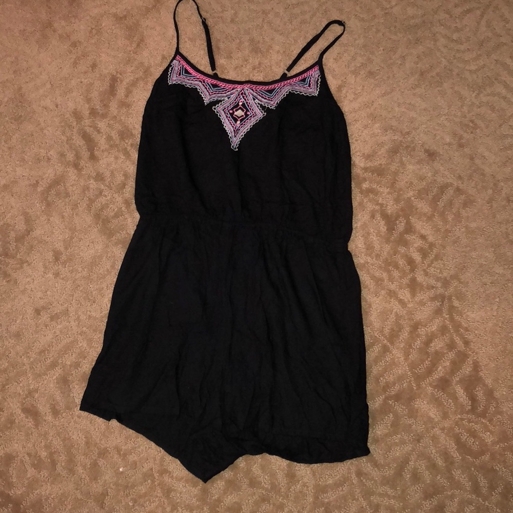 Black romper with pink, blue and white design